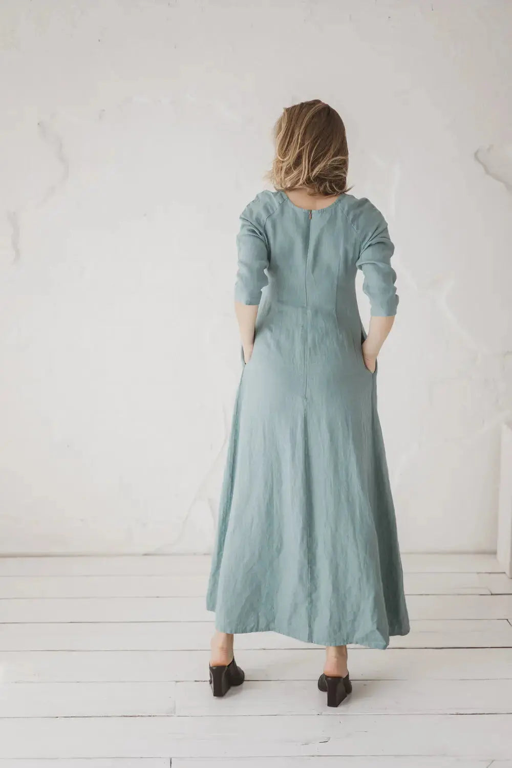 Elegant minimalist back view of linen maxi dress with raglan sleeves