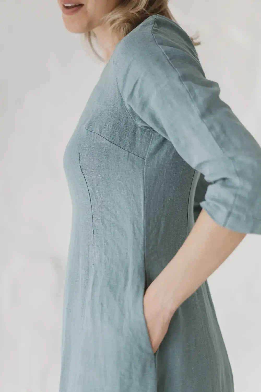 Close-up of functional side pockets on a high-quality linen maxi dress