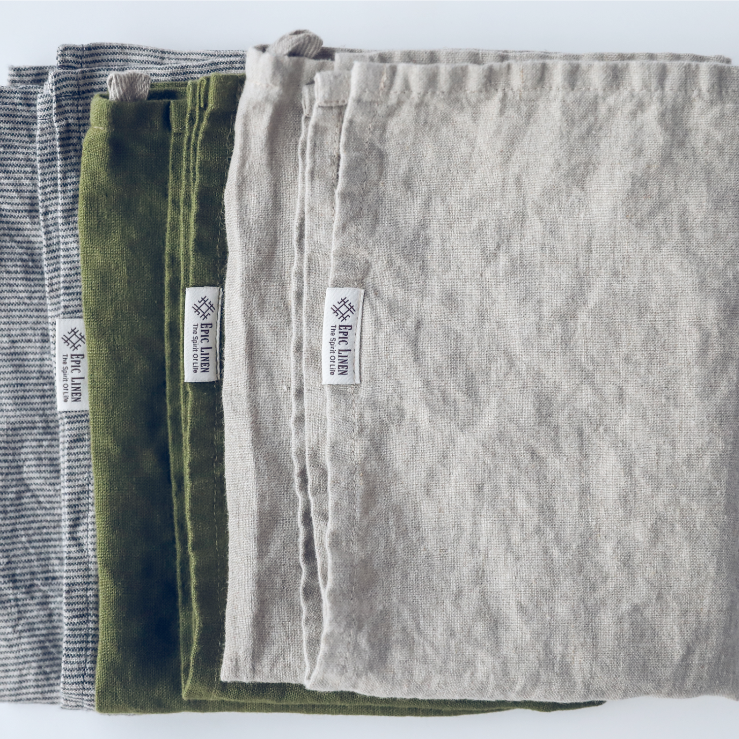 Three folded linen kitchen tea towels