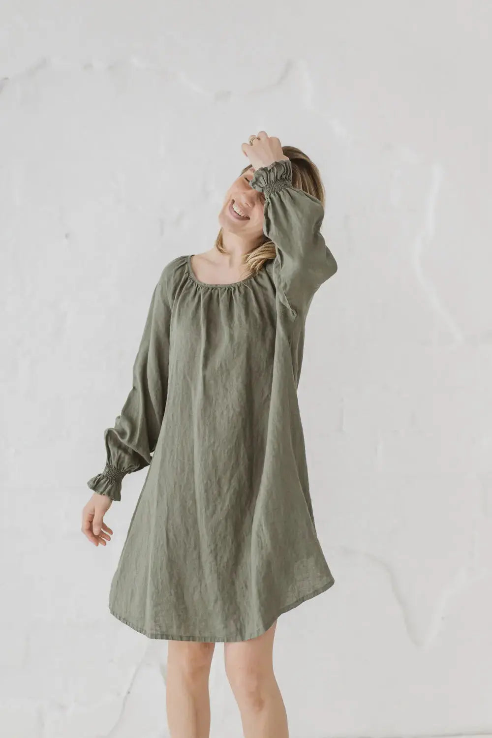 Linen Mini Dress Marea — relaxed lifestyle shot with bishop sleeves