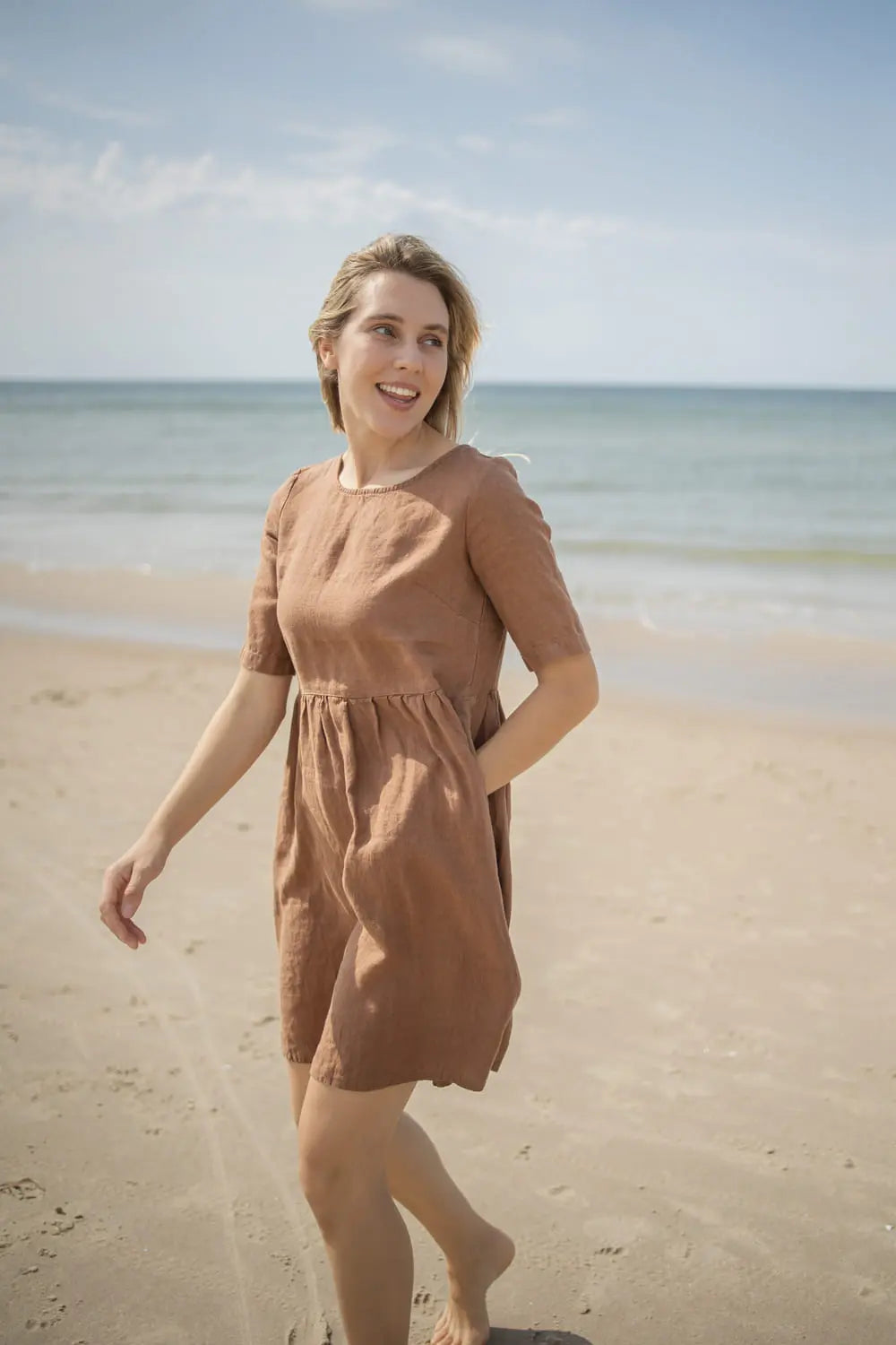 Linen Dress with Pockets, front view, walking on the beach