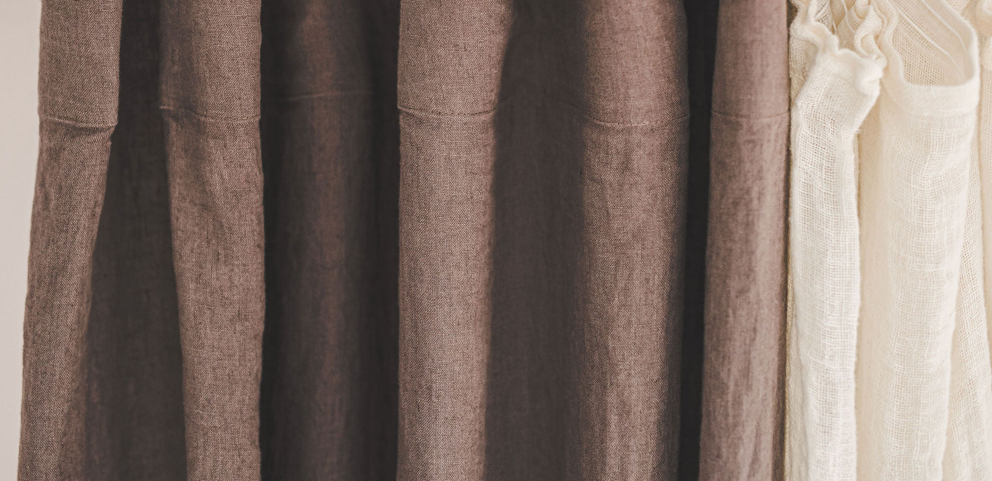 Top of coffee color curtains in medium weight linen.