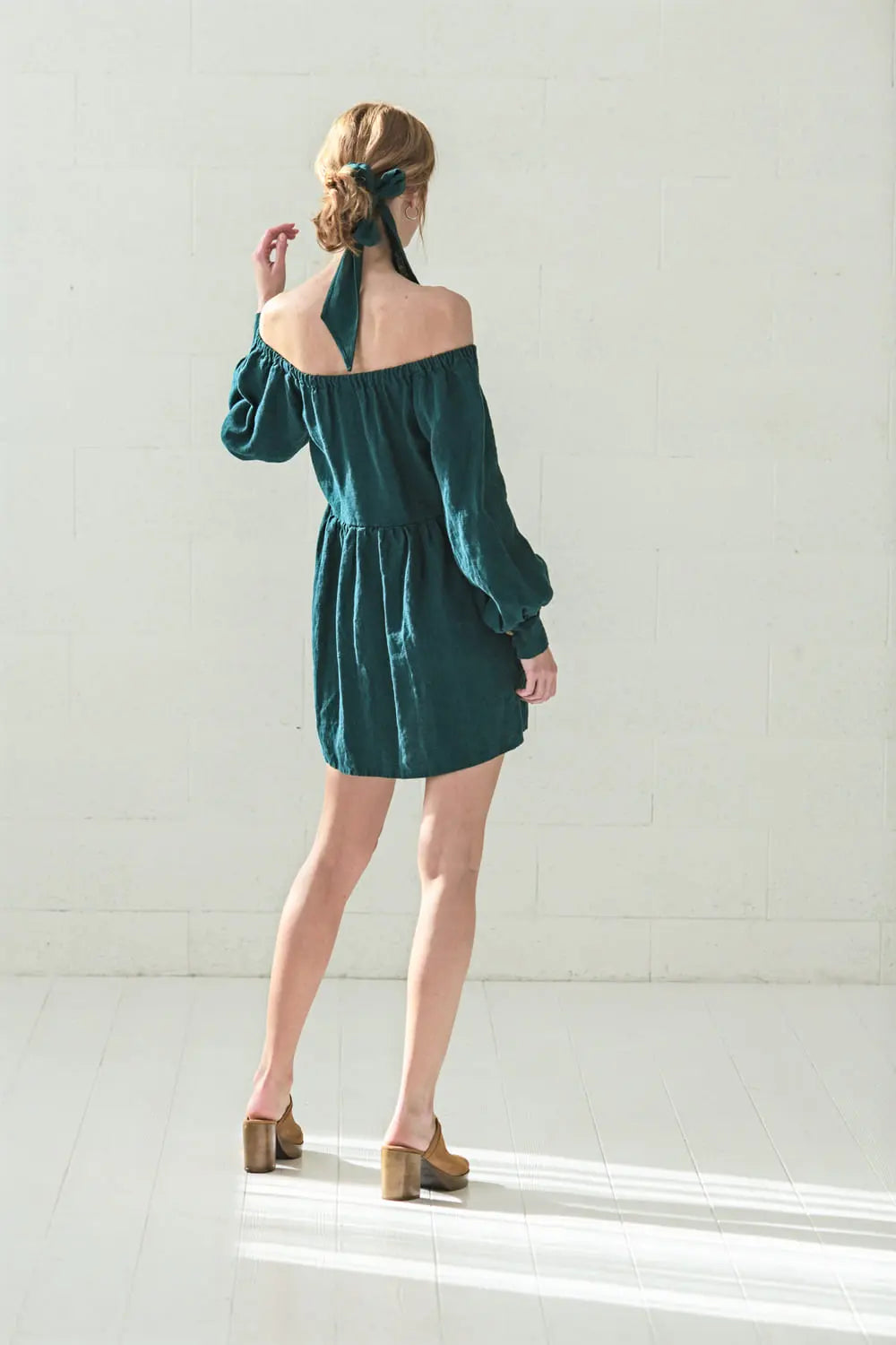 Back view of linen off-shoulder mini dress with balloon sleeves