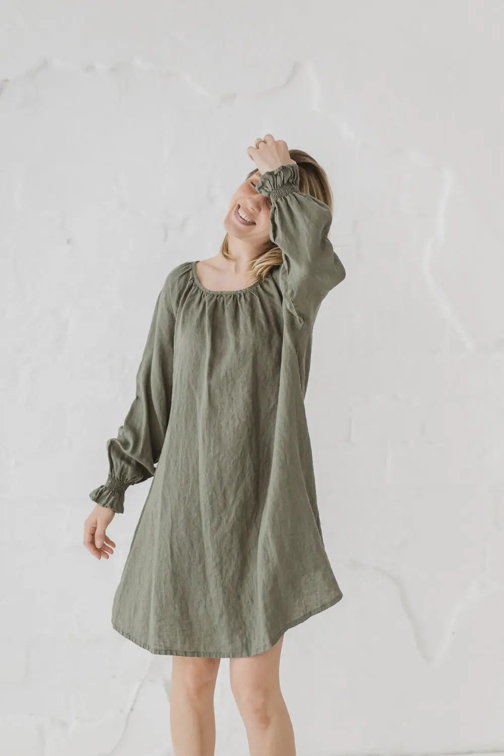 Linen Mini Dress Marea — relaxed lifestyle shot with bishop sleeves