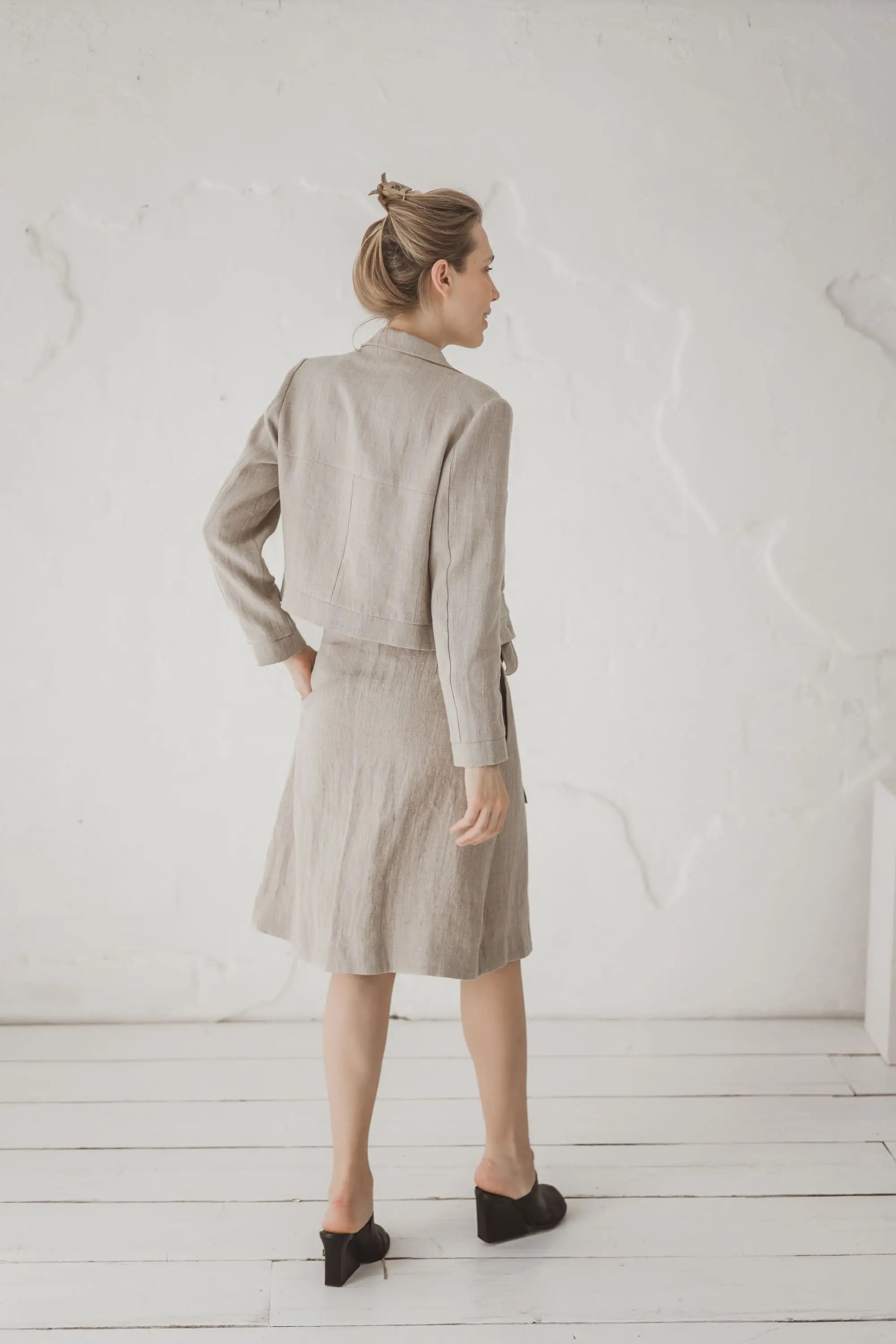 Structured Cropped Linen Blazer — back view with linen skirt and heels